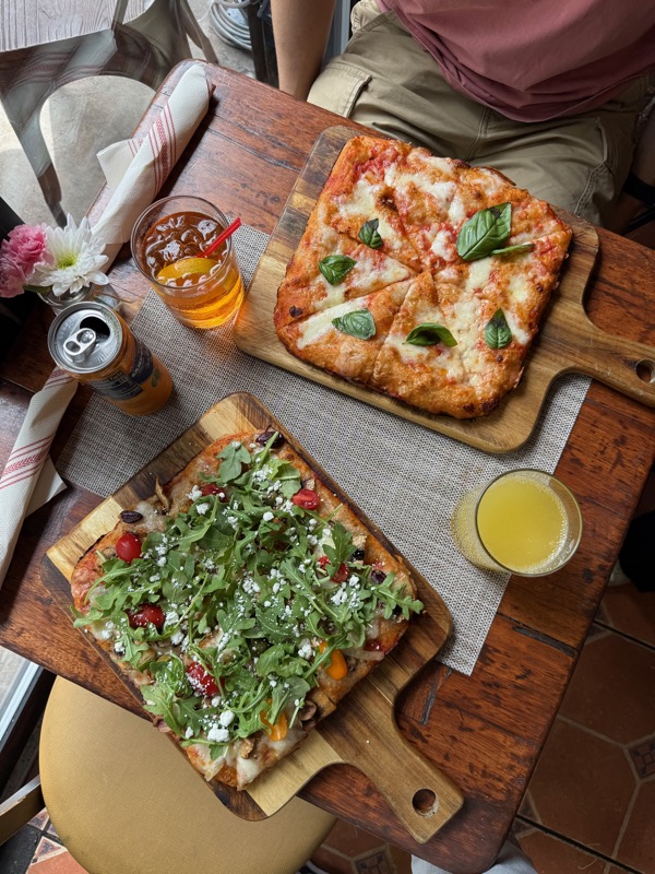 Fresh focaccia served on wooden boards at Arco Cafe