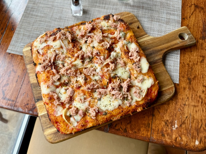 Focaccia Al Tonno — mozzarella, capers, onions, and tuna with oregano