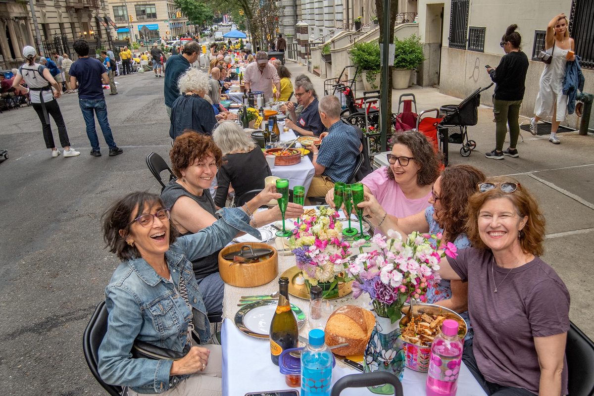 Neighbors gathered at the long table on W. 103rd Street, Upper West Side, 2025