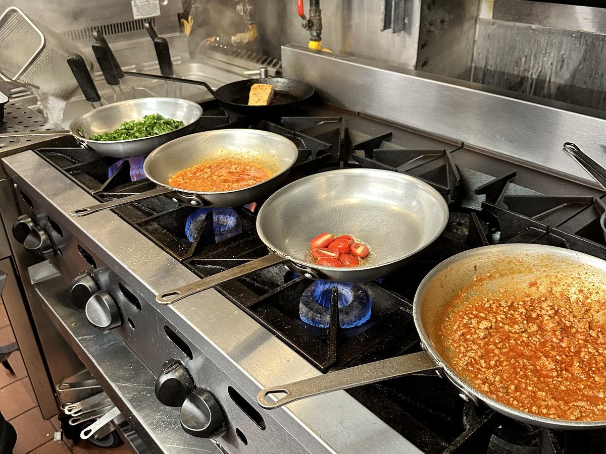 Handmade Sardinian pasta being prepared in the Arco Cafe kitchen — fresh malloreddus and fregula made daily